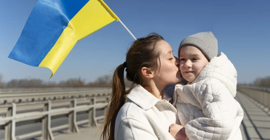 charlotte for Ukraine mother kissing little kid