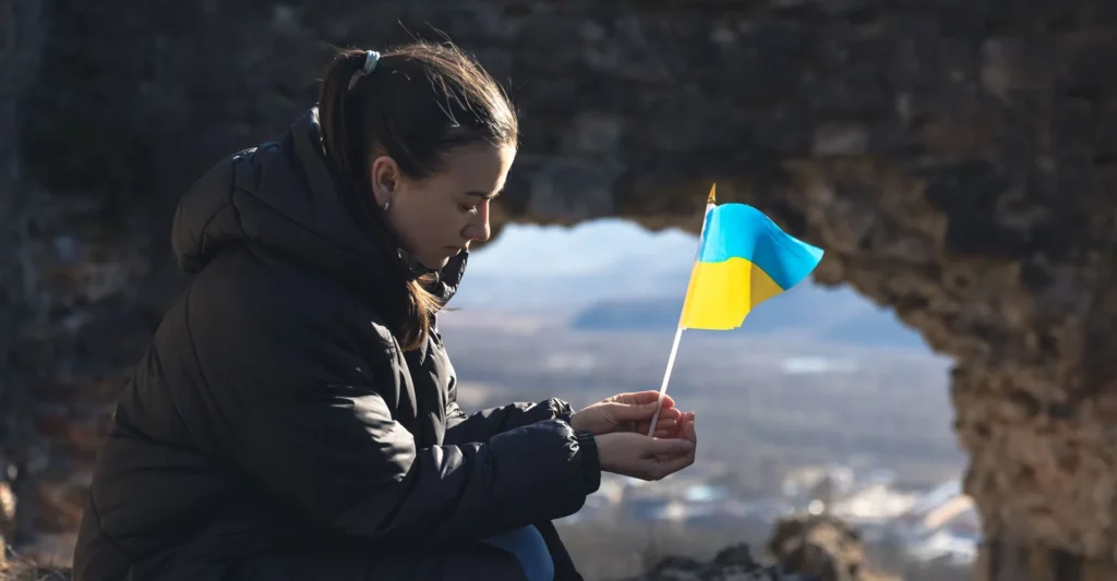 charlotte for Ukraine young woman with flag Ukraine her hands